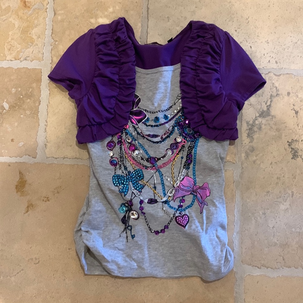 A cute top in the brand tempted girls